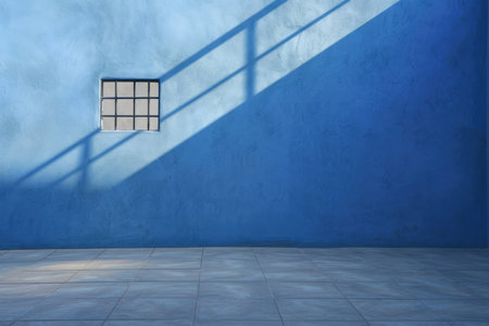 Clean And Modern Blue Backdrop Featuring Subtle Window Shadows On Plaster. Ð¡oncept Abstract Art Exhibition, Fashion Runway Show, Nature-Inspired Landscapes, Creative Food Photography.の素材