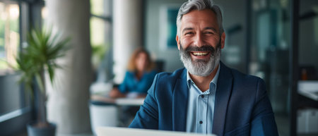 Joyful Middleaged Man With Laptop In CEO Office, Thriving In Corporate World. Ð¡oncept Corporate Success, Middle-Aged CEO, Thriving In Business, Executive Lifestyle, Entrepreneurship.の素材