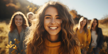 Diverse group of friends enjoying outdoor activities Focus on smiling woman. Concept Outdoor Photoshoot, Happy Friends, Diverse Group, Smiling Woman, Outdoor Activitiesの素材