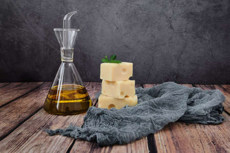 Different raw uncooked Italian pasta and cheese on wooden table. Diet and food concept.の写真素材