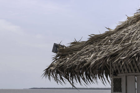 Straw roofing at a scenic restaurant の写真素材