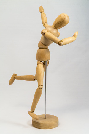 wooden dummy to paint  dabbing on white backgroundの写真素材
