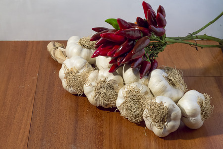 hot peppers red and garlic braidの写真素材