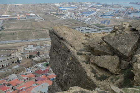 Huge rocks stand in the mountainous stony hilly terrainの写真素材