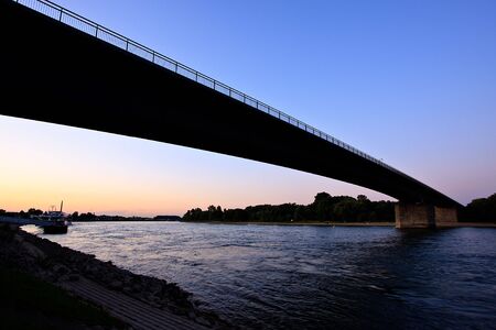 View of river Rhine near Speyer, Germany, at sundown in summerの写真素材