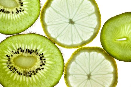 Sliced Kiwifruit, Lemon and Starfruit isolated on white studio shotの写真素材