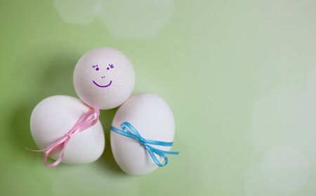 Easter Eggs with blue and pink ribbons