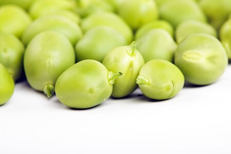 Fresh green peas isolated on white studio shot
