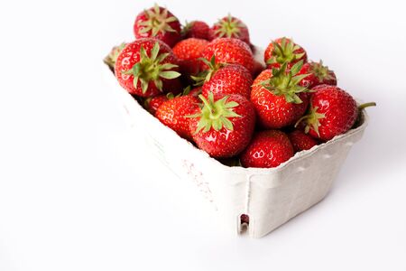 Box of red strawberry isolated on white backgroundの写真素材