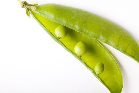 Fresh green peas isolated on white studio shot