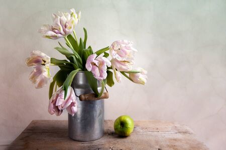 Still-Life with blue Pink Tulips in tin canの写真素材