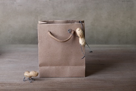 Miniature with Peanut People Climbing into Shopping bag