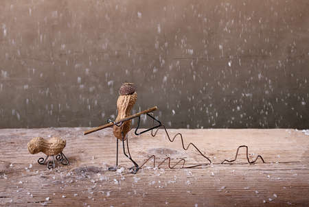 Miniature with Peanut People in the Forest to Fell a Christmas Tree