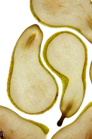 Fresh ripe Pears cut in thin slices on white background studio shot
