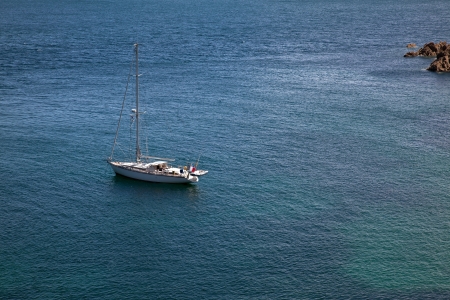 Sail Ship anchoring in a bay in Brottany Franceの写真素材