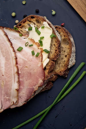 Slices of Bread with Ham, Butter and Chivesの写真素材