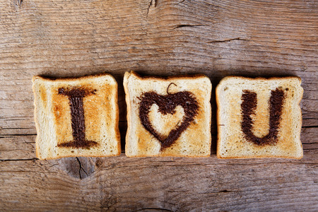 I Love You painted with hazelnut cream on white toast breadの写真素材