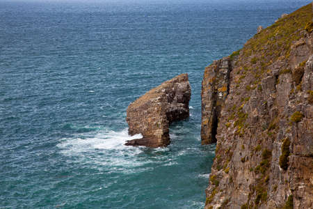 Cliffs with Heath vegetation at Cap Frehel in Brittany Franceの写真素材