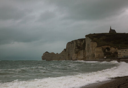 Cliffs at Etretat with the Chapel Notre-Dame-de-la-Garde in the Evening in Autumnの写真素材