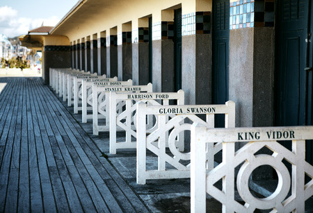 Beach Closets with Actor Names at Promenade des Planches in Deauville Normandy France Europe in Autumnのeditorial素材