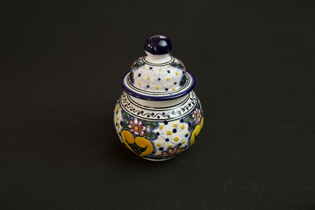 Little innocent Talavera vase at the center of an elegant black backgroundのeditorial素材
