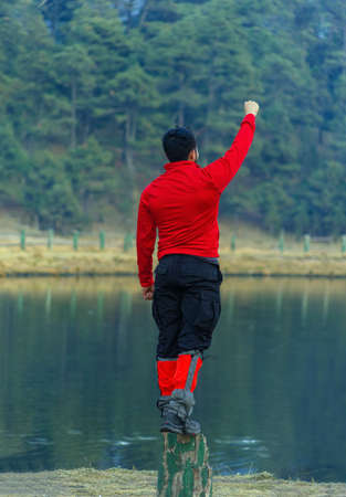 happy man by the lakeの写真素材