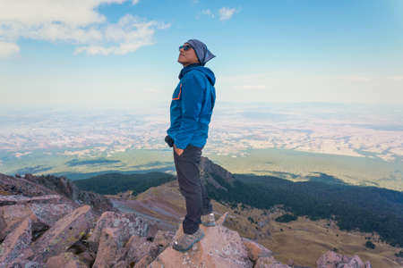 Man standing on mountain top