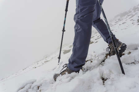 Man walk in the winter in the snow