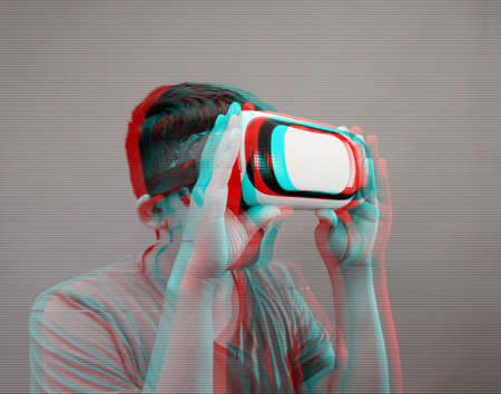 boy using virtual reality simulator headset