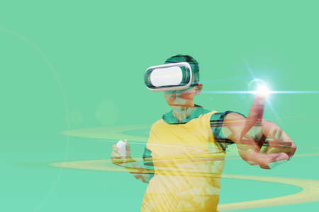 boy using virtual reality simulator headset on green background