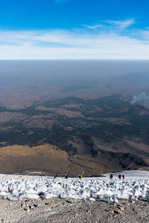 mountaineers walking on the glacier of the volcano pico de orizaba