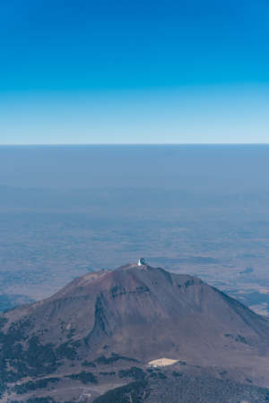 aerial view of the sierra negra volcano and the millimeter telescope