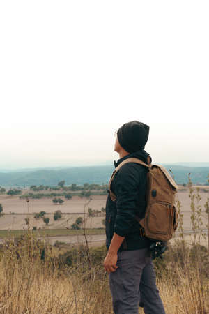 Male tourist on top of mountain