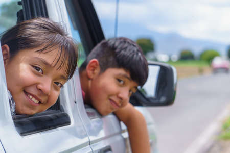 Happy smiling little girl child goes to summer travel tripの写真素材