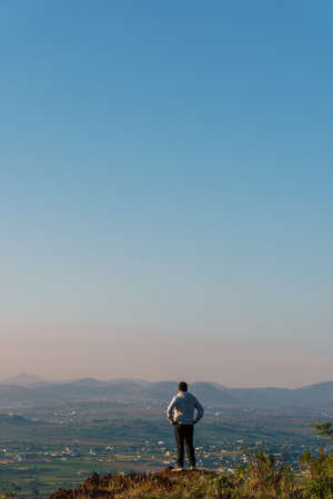 hispanic male hiking in mountains
