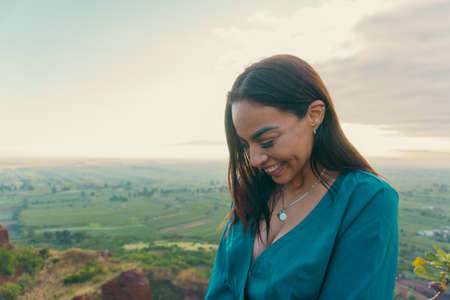 Girl at hill in sunrise