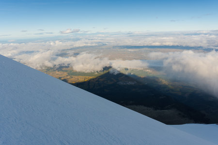 the shadow of the pico de orizaba volcano on the jamapa glacierの写真素材