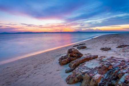 Calm beautiful beach on island with colorful sunsetの写真素材