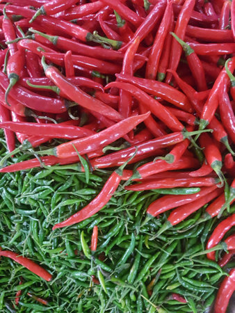 Fresh chillies for sale at the marketの素材
