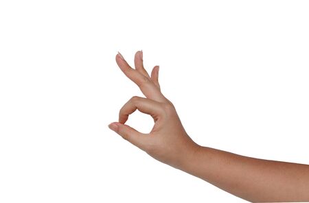 Woman hand take gesture of okay isolated on white backgroundsの写真素材