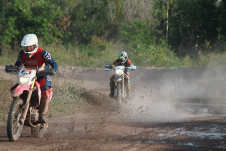 Rayong ,Thailand - JUNE 20, 2020 : Thai Motocross racer accelerating in dirt trackl. in practice motocross field at Thailand.のeditorial素材