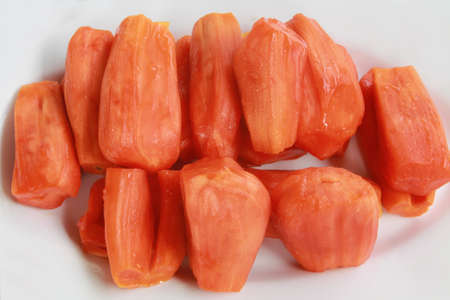 Close up Ripe red Jackfruit on the white dish , Jackfruit is the sweet and delicious fruit of Thailandの写真素材