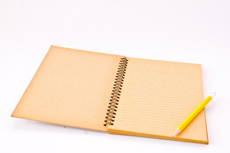Brown Spiral Notebook with yellow pencilの写真素材