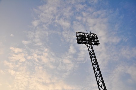 Football Stadium Floodlights with cloud and evening skyの写真素材
