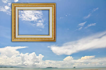 Gold Picture Frame on Blue Sky Backgroundの写真素材