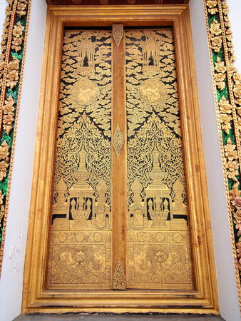 The golden painting at the back side door of the main temple of  Wat Chaloem Phrakiat Nonthaburi Thailand.の写真素材