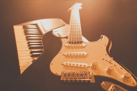 Guitar and piano keyboard.の写真素材