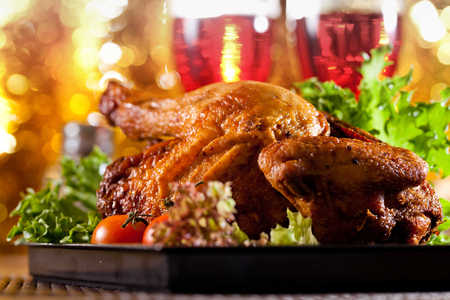 Roasted chicken on table with wineの写真素材