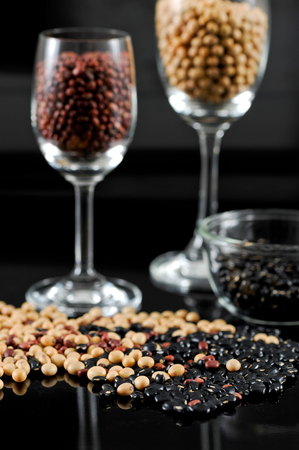 Dried grains collection on black background.の写真素材