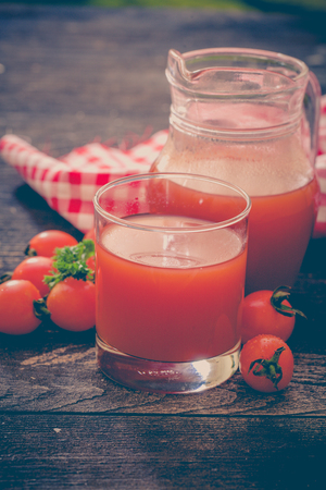 Fresh tomato juice and tomatoesの写真素材